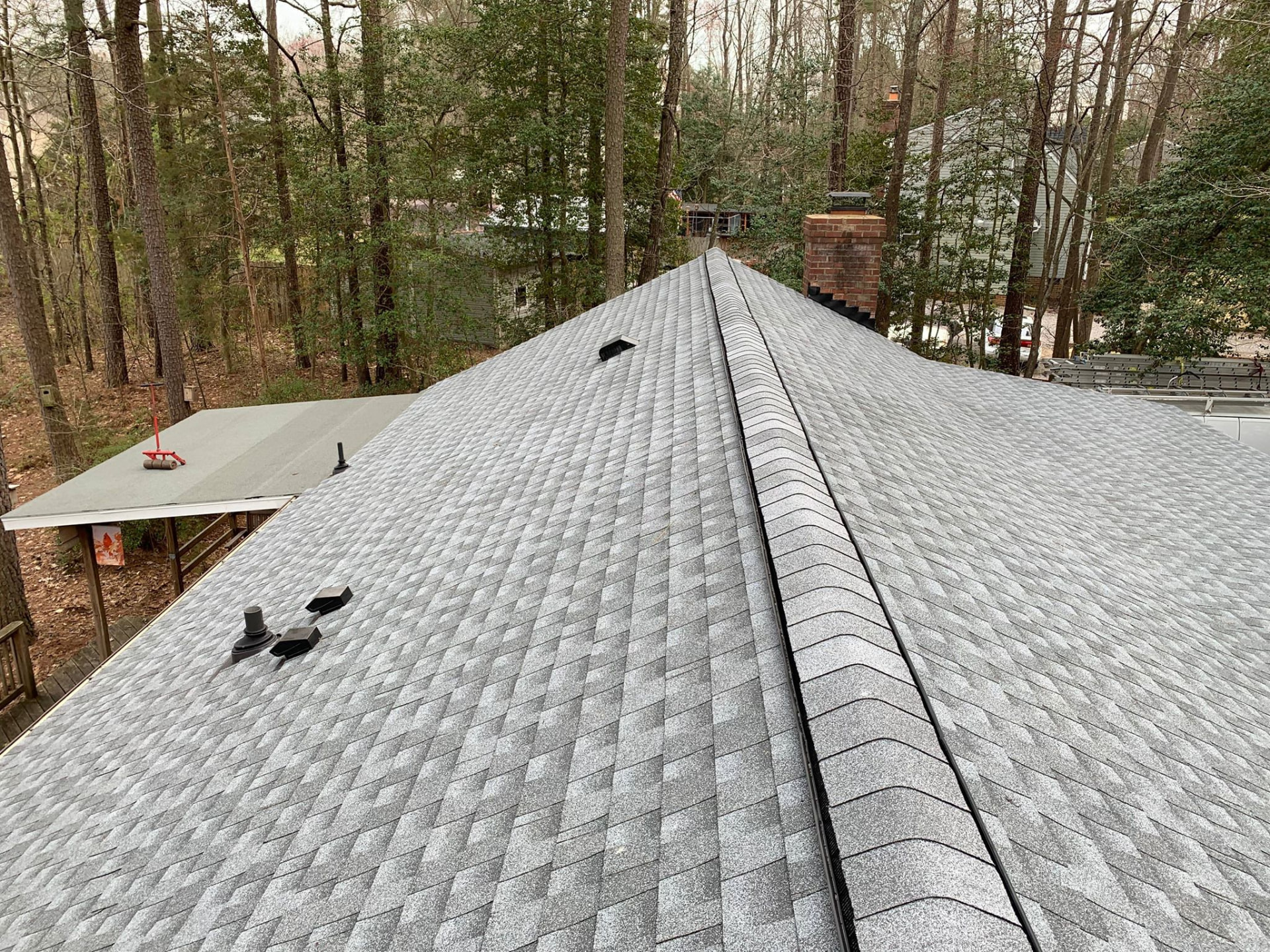 Finished architectural shingle roof with new ridge vent